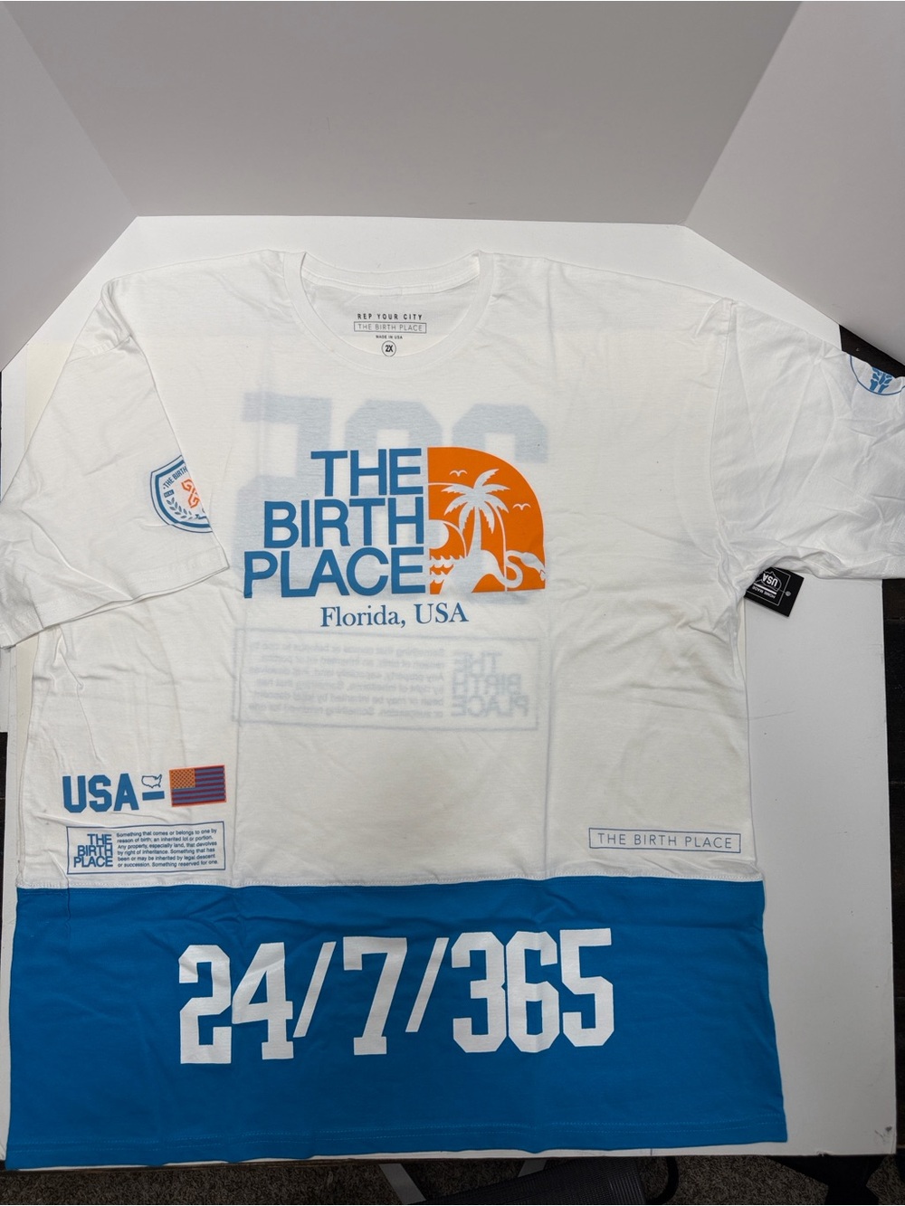 The Birth Place Graphic Tee - White with Blue & Orange